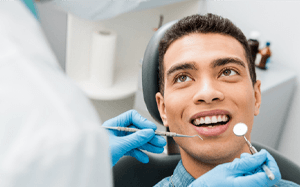 a patient receiving a dental examination