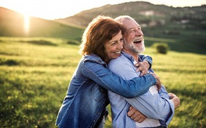 Man and woman embracing in a field