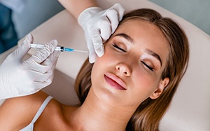 a woman receiving a BOTOX injection