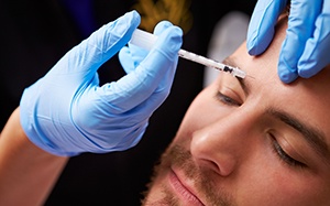 a man receiving a BOTOX injection