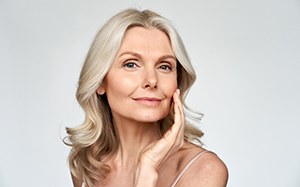 an older woman smiling after receiving BOTOX