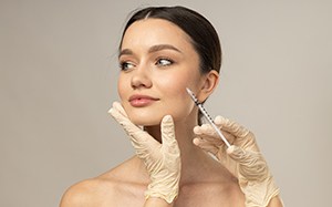 a patient smiling before BOTOX® treatment