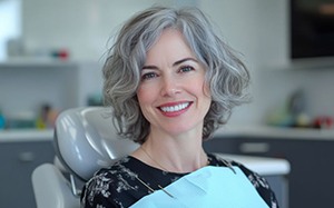 Happy dental patient in treatment chair